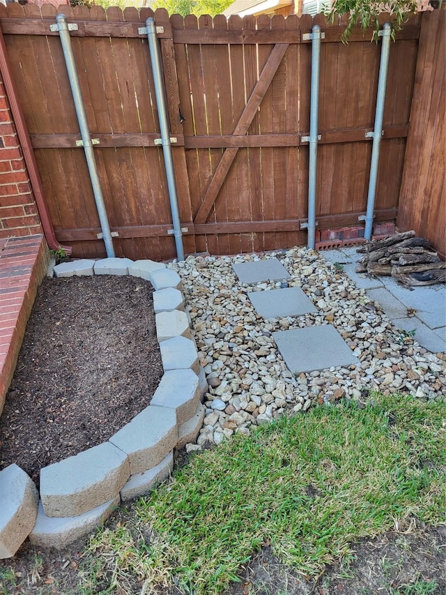 view of gate with fence