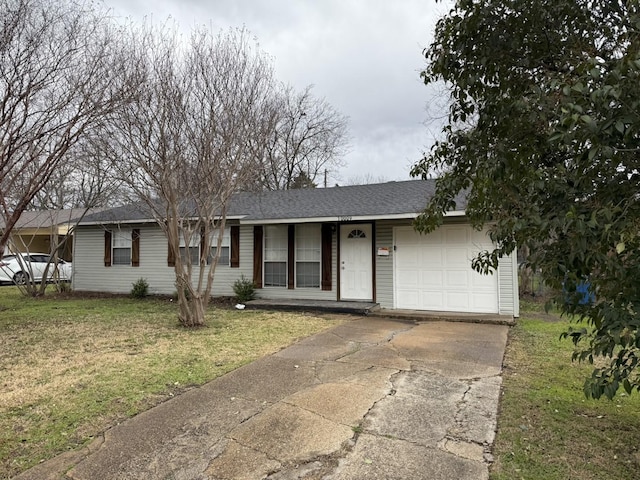 ranch-style home featuring an attached garage, concrete driveway, a front lawn, and a shingled roof