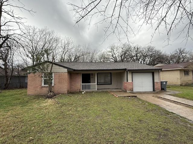 single story home featuring concrete driveway, a garage, brick siding, and a front lawn