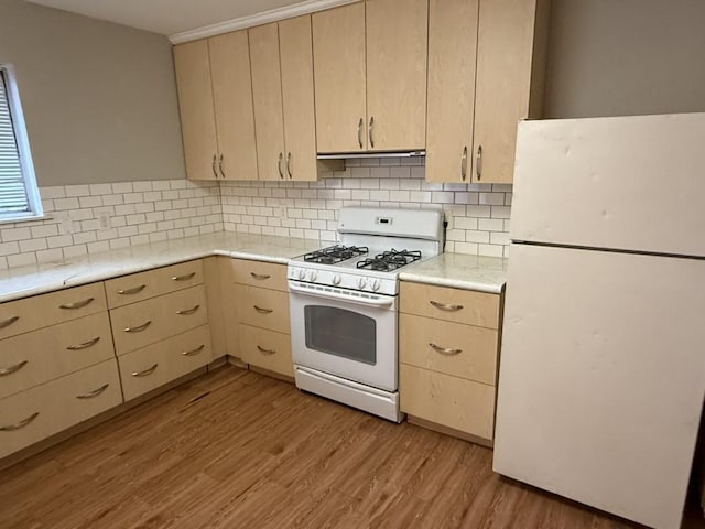 433 Alcorn Ave, Dallas, TX 75217 - kitchen featuring white appliances, light wood-style floors, light brown cabinetry, and light countertops