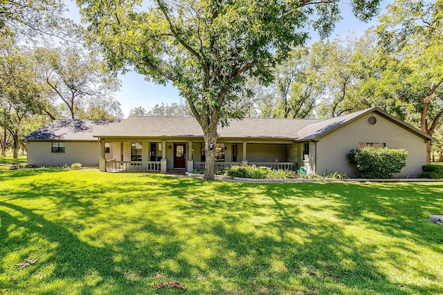 single story home with brick siding, a porch, and a front lawn