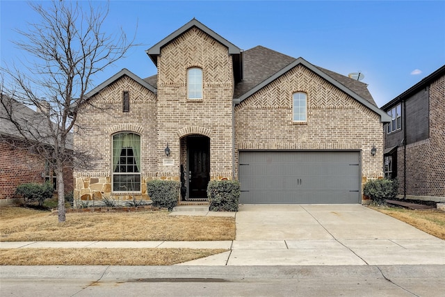 french country inspired facade featuring concrete driveway, brick siding, and roof with shingles