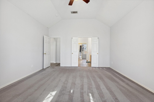 unfurnished bedroom featuring visible vents, baseboards, a ceiling fan, and high vaulted ceiling