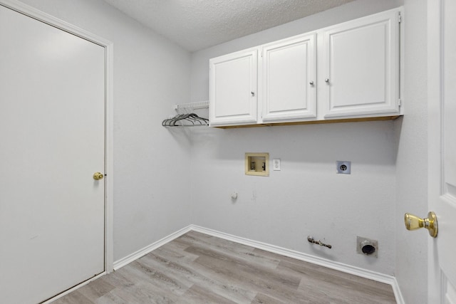 washroom featuring hookup for a washing machine, light wood finished floors, hookup for an electric dryer, and gas dryer hookup