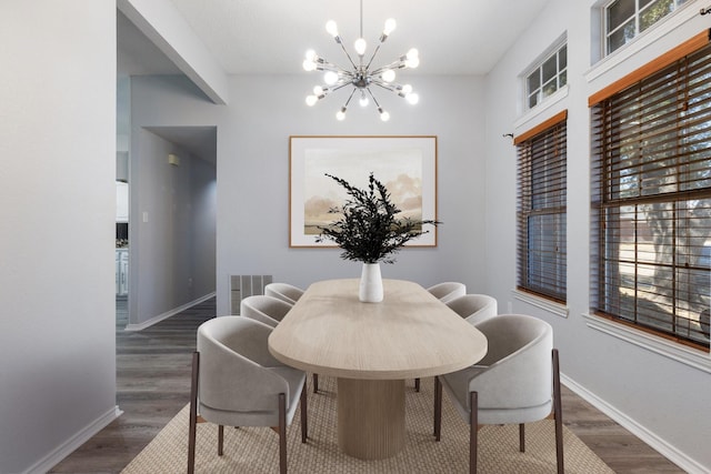 dining room featuring an inviting chandelier, dark wood-style floors, baseboards, and visible vents