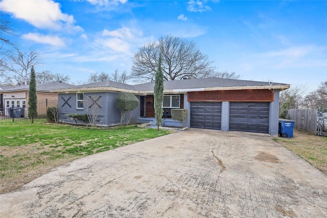 ranch-style home with driveway, brick siding, a front lawn, and fence