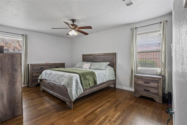 5621 Rocky Ridge Rd, Dallas, TX 75241 - bedroom with wood finished floors, baseboards, visible vents, ceiling fan, and a textured ceiling