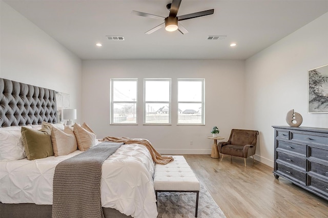 bedroom featuring recessed lighting, baseboards, visible vents, and light wood-type flooring