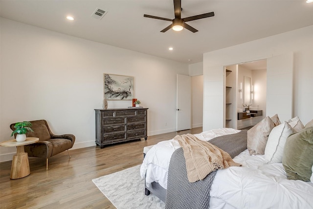 bedroom featuring visible vents, recessed lighting, light wood-type flooring, and baseboards