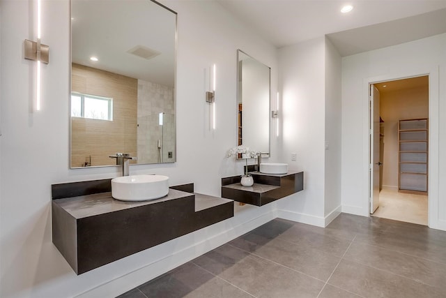 bathroom with visible vents, a walk in shower, recessed lighting, baseboards, and vanity