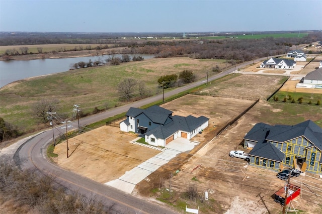 drone / aerial view featuring a rural view and a water view