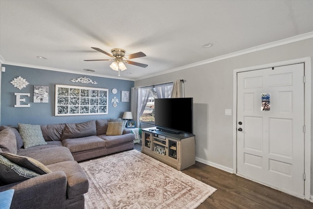 living area featuring ceiling fan, baseboards, dark wood-type flooring, and ornamental molding