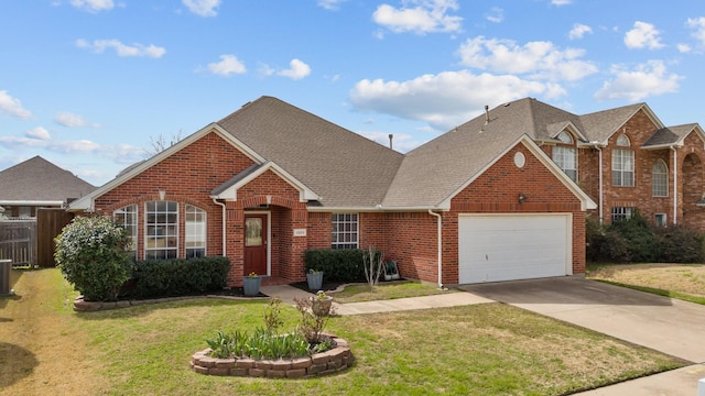 view of front of home with brick siding, concrete driveway, a front yard, roof with shingles, and a garage