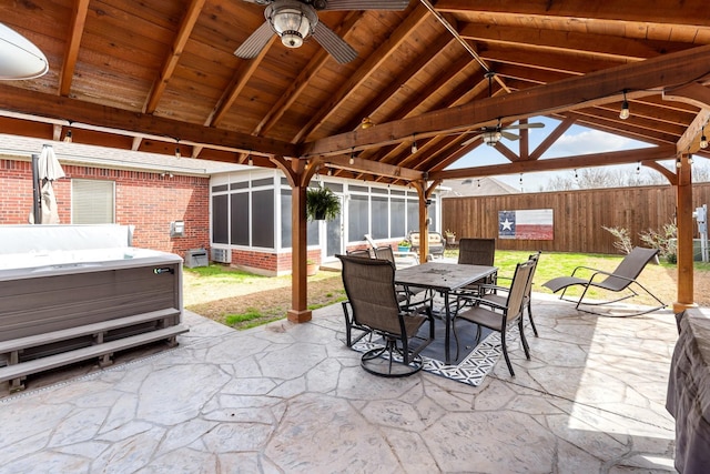 view of patio / terrace featuring ceiling fan, a gazebo, outdoor dining space, and fence