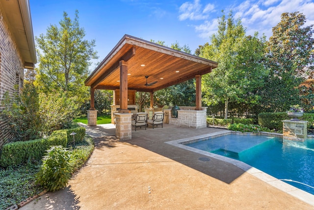 outdoor pool featuring a gazebo, a patio, and outdoor dry bar