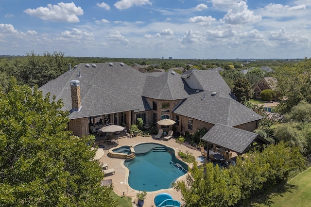 view of pool with a gazebo, a patio, outdoor dining space, and a pool with connected hot tub