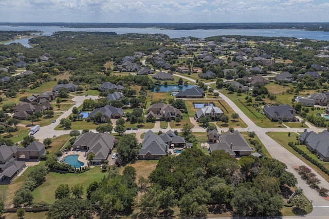 bird's eye view with a residential view and a water view