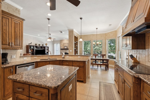 kitchen featuring brown cabinets, ornamental molding, a sink, a center island, and dishwasher