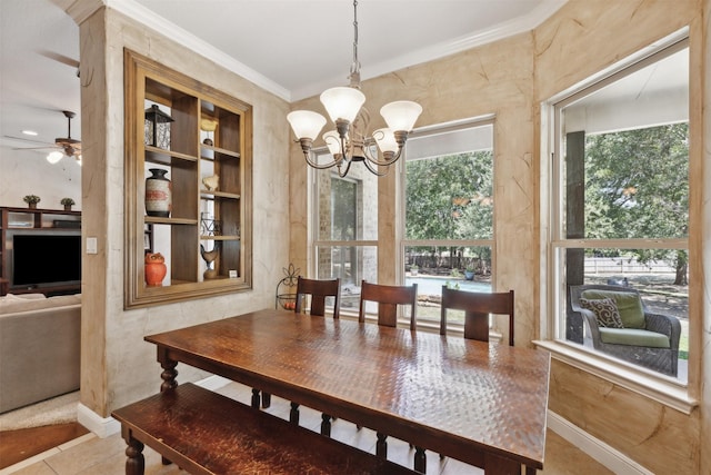 dining space with tile patterned flooring, ceiling fan with notable chandelier, built in shelves, and ornamental molding