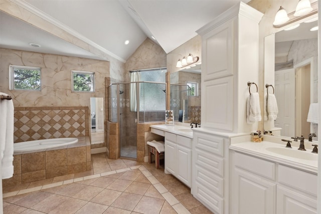 bathroom with tile patterned floors, a garden tub, a sink, tiled shower, and vaulted ceiling