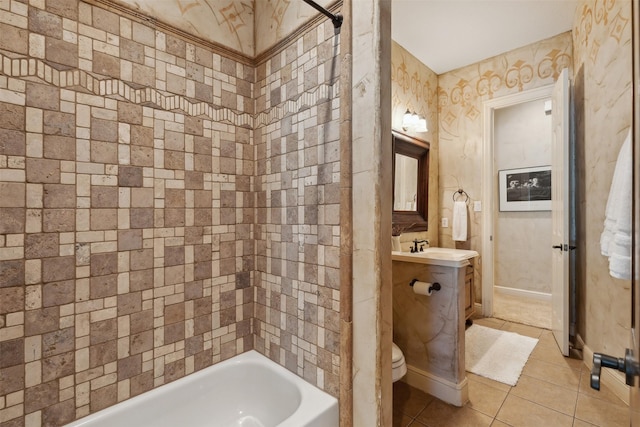 bathroom featuring baseboards, toilet, vanity, and tile patterned flooring