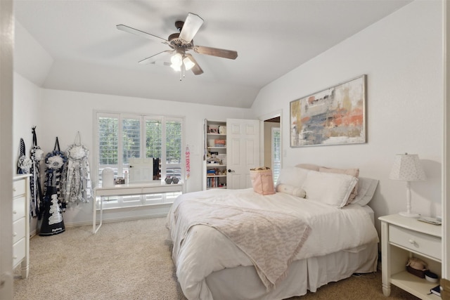 bedroom with baseboards, a ceiling fan, lofted ceiling, and carpet floors