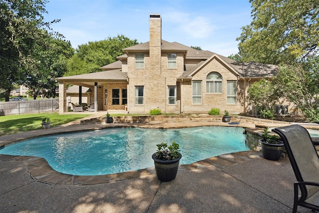 view of swimming pool with a patio, fence, and a fenced in pool