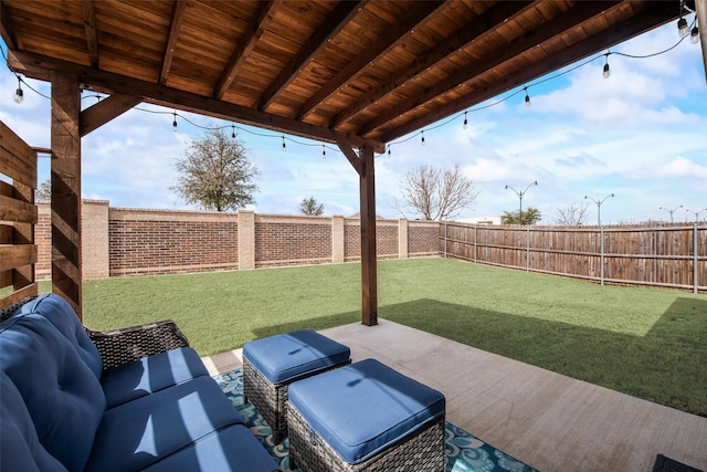 view of patio featuring outdoor lounge area and a fenced backyard