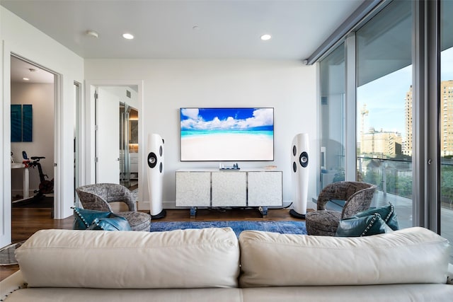 living room with wood finished floors and recessed lighting