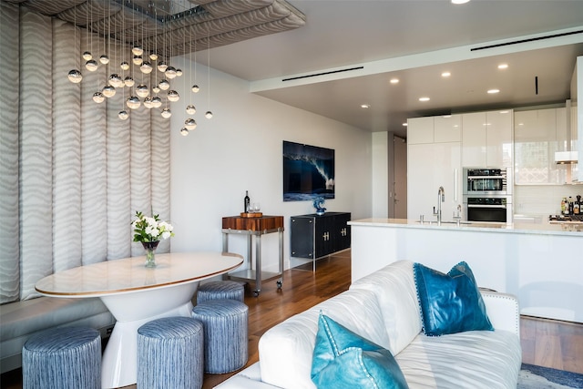 living room featuring wood finished floors and recessed lighting