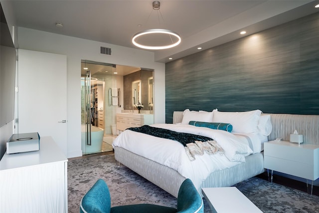 bedroom with recessed lighting, visible vents, and connected bathroom