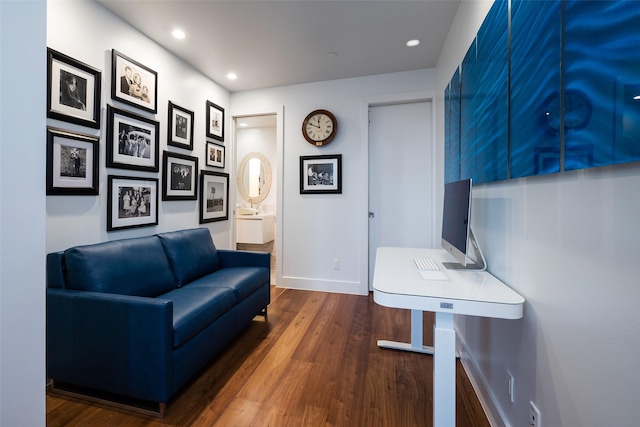 living area with baseboards, dark wood-style floors, and recessed lighting