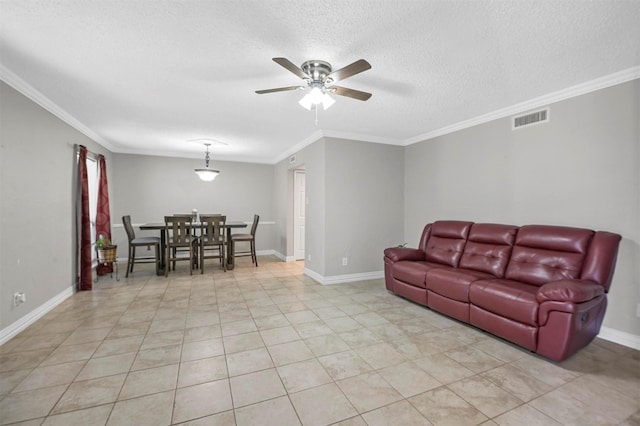 living area featuring visible vents, a ceiling fan, a textured ceiling, crown molding, and baseboards