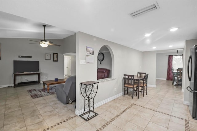 interior space with visible vents, ceiling fan, baseboards, light tile patterned floors, and recessed lighting