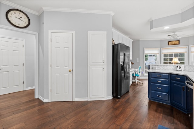 kitchen with blue cabinetry, black fridge with ice dispenser, dark wood-style floors, crown molding, and light countertops