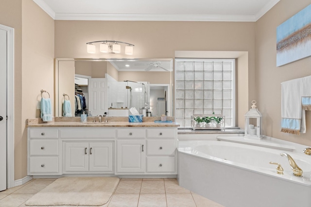 full bathroom featuring a garden tub, a stall shower, ornamental molding, tile patterned flooring, and vanity