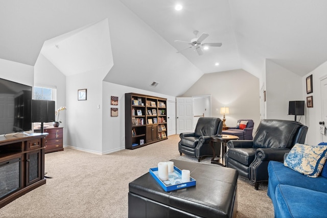 living area with carpet flooring, ceiling fan, baseboards, and lofted ceiling