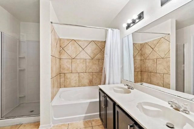 full bath with tile patterned flooring, curtained shower, and a sink