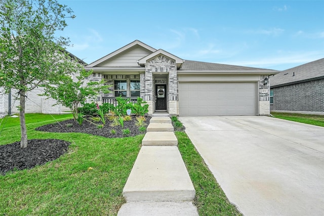 view of front of home with a front lawn, concrete driveway, and an attached garage