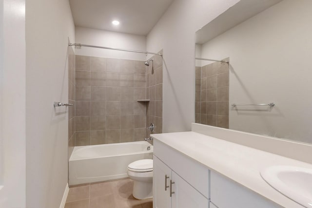 bathroom with tile patterned flooring,  shower combination, toilet, and vanity