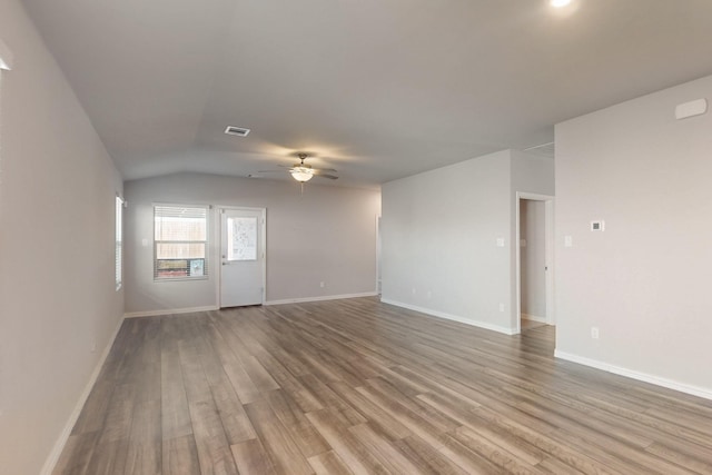 spare room with visible vents, baseboards, ceiling fan, and wood finished floors