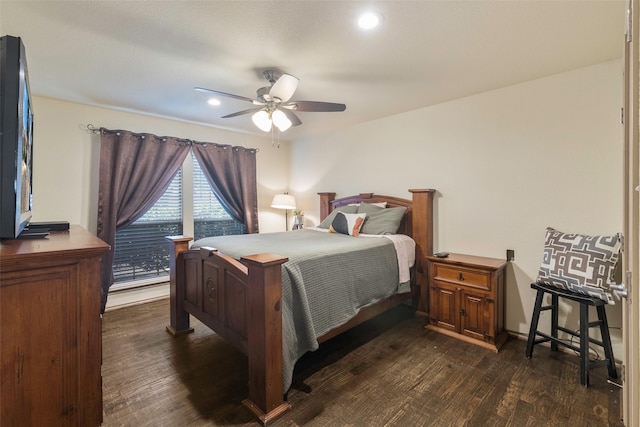 bedroom with ceiling fan and dark wood-style flooring