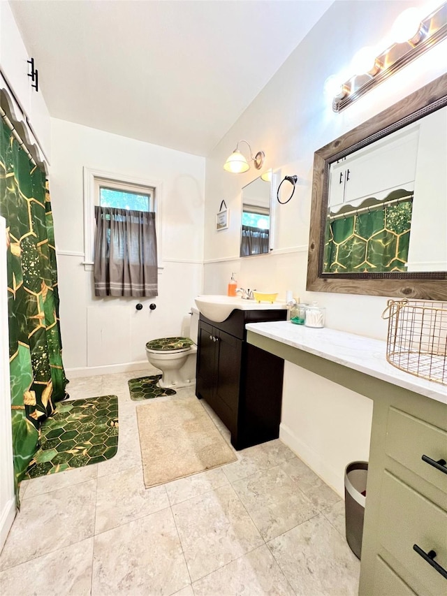 full bathroom featuring vanity, tile patterned floors, toilet, and a shower with curtain