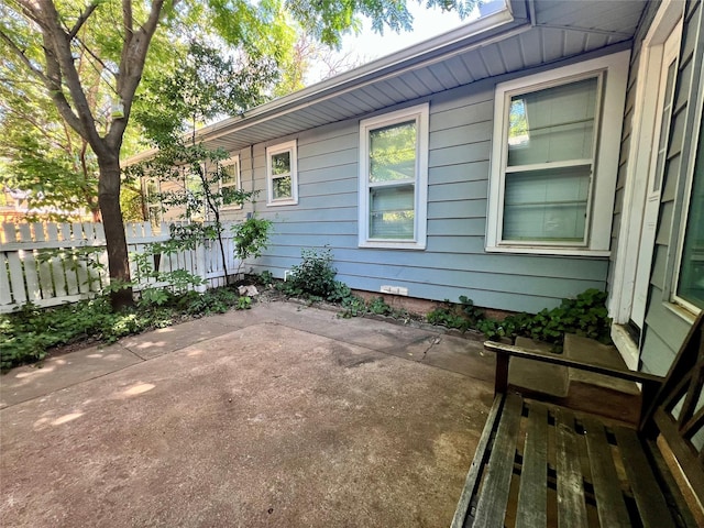 view of patio / terrace featuring fence