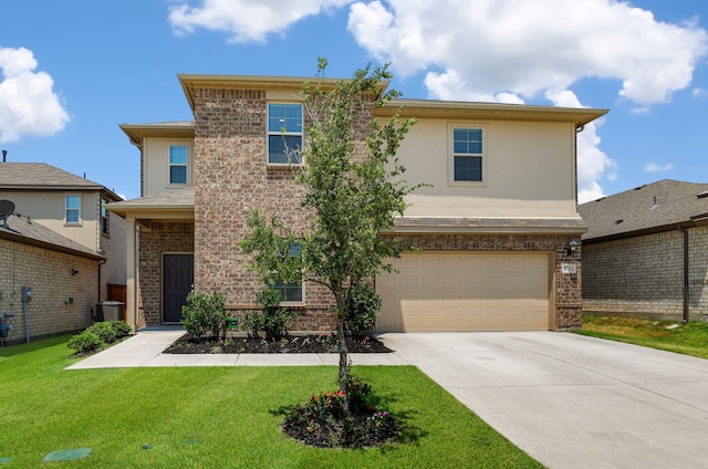 traditional-style home with a front lawn, concrete driveway, and brick siding