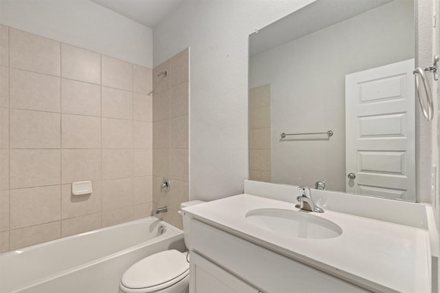 bathroom featuring shower / bath combination, toilet, and vanity