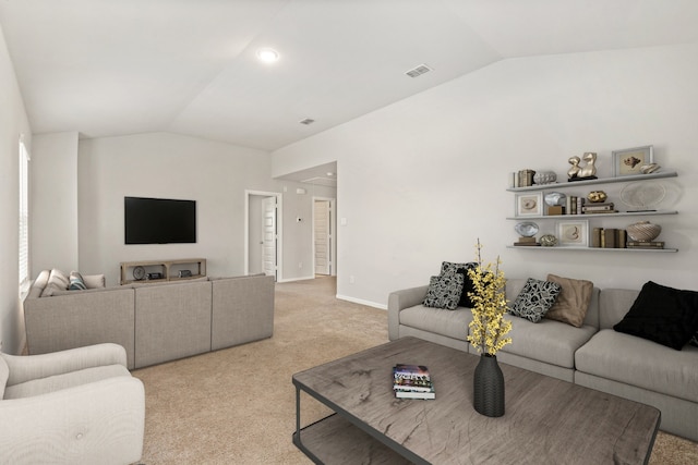 living room featuring vaulted ceiling, light colored carpet, visible vents, and baseboards