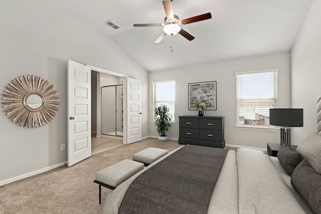 bedroom with visible vents, lofted ceiling, light colored carpet, and baseboards