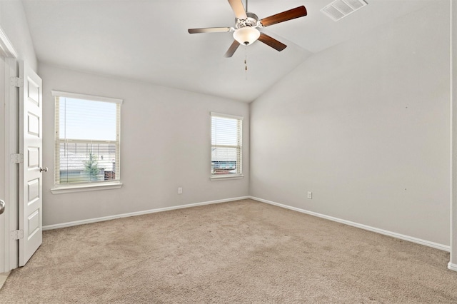 unfurnished room with a ceiling fan, baseboards, visible vents, vaulted ceiling, and light carpet