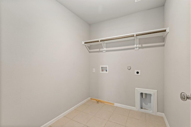 laundry area with baseboards, gas dryer hookup, hookup for an electric dryer, laundry area, and washer hookup